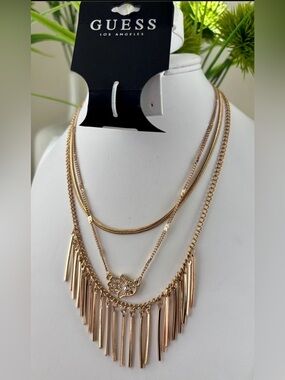 Guess Layered 3 chain,elongated dangling bars create a fringe,Hamsa hand